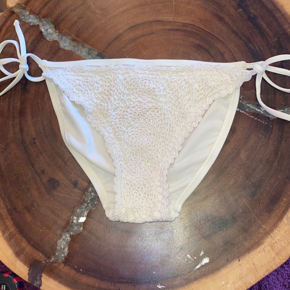 Ivory/ cream Crochet tie swim bottoms. Size M